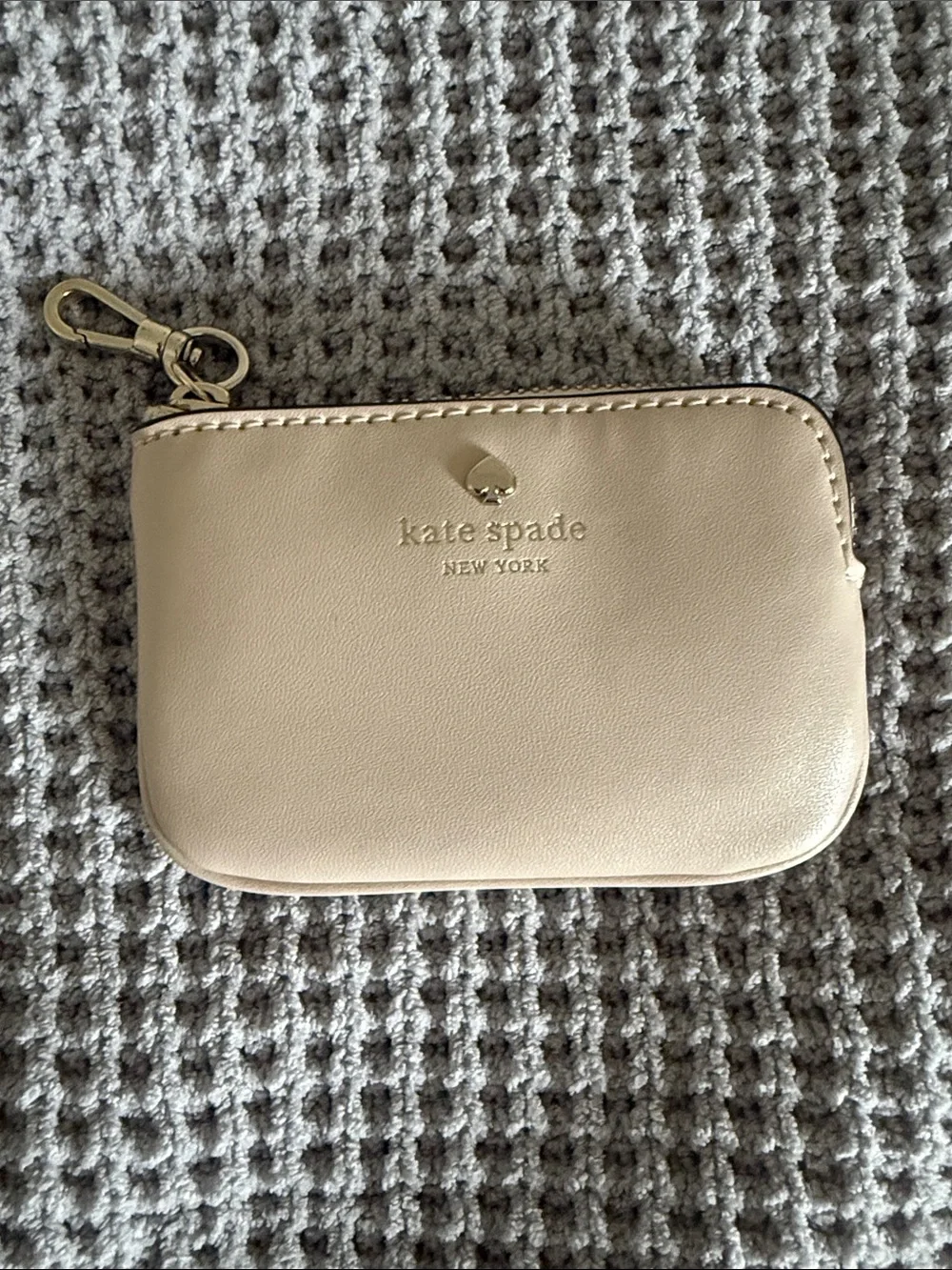 Kate Spade cream faux leather coin pouch with gold hardware